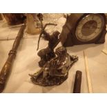 Cast resin figural sculpture and a model Oriental archer