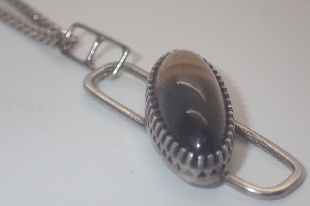 Hallmarked silver tigers eye pendant on a silver curb chain