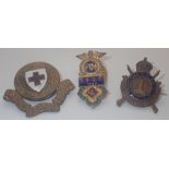 Three antique brass and enamel badges