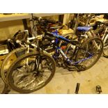 Moongoose Sector black and blue mountain bike with front suspension front and rear disc brakes and