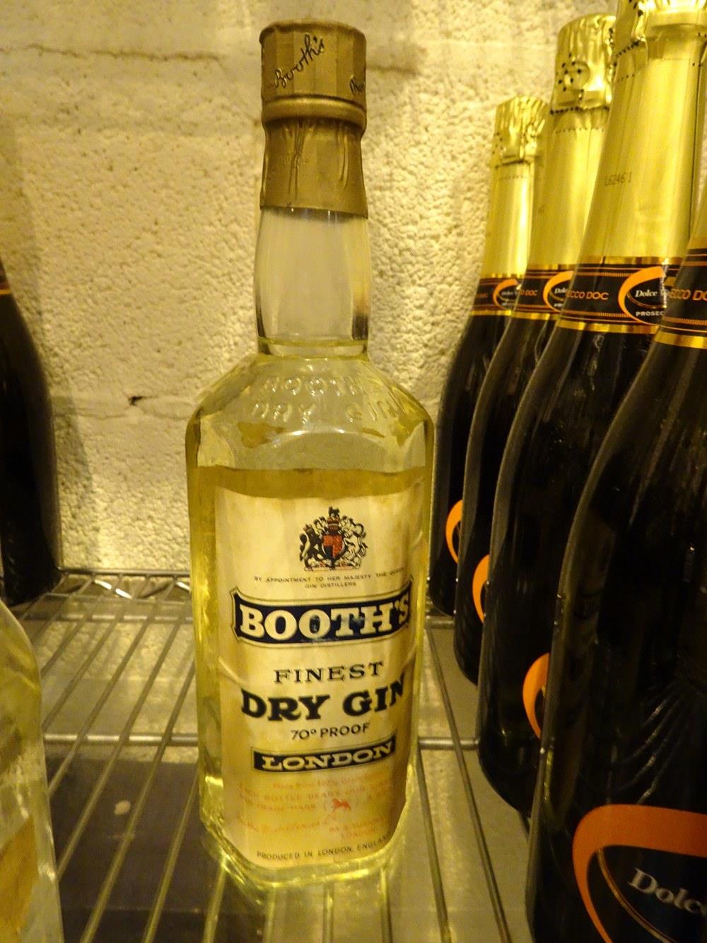 Bottle of Booths finest London dry gin level to bottom of neck no volume stated but 75cl 1961