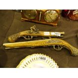 Two reproduction flintlock pistols