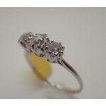 Antique platinum three stone diamond ring, approximately 0.