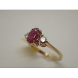 18ct gold oval ruby and diamond ring,