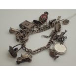 Silver charm bracelet with twelve charms