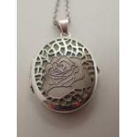 Silver locket with rose decoration on a silver chain