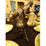 Brass telescope inscribed W Ottaway on stand