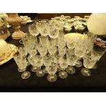 Large collection of crystal drinking glasses and an Edwardian decanter