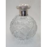 Heavy cut glass globular perfume bottle with fitted glass stopper hallmarked Sapnish silver collar