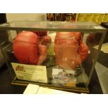 Double box framed signed boxing gloves of the two former world heavyweight champions,