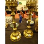 Pair of brass ecclesiastical style candle holders H: 50 cm CONDITION REPORT: P&P to