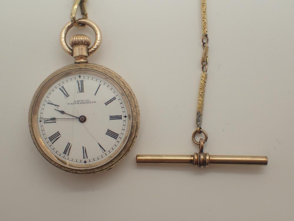 Gold plated Waltham fob watch on a yellow metal chain CONDITION REPORT: This item is