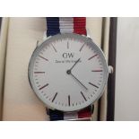 New and boxed white metal Daniel Wellington wristwatch on a fabric strap
