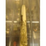 Antique hand carved ivory cigarette holder with engraved lion design L: 8 cm