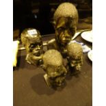 Four vintage African stone sculptured heads one with Tinapi to base tallest H: 29 cm