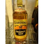 Bottle of Gordons orange gin c1960 level to shoulder top 75cl CONDITION REPORT: We
