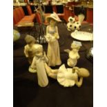 Four Nao figurines and a Lladro cherub