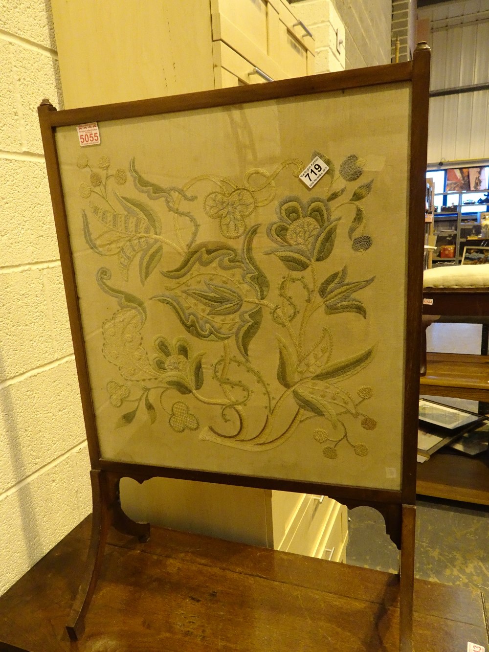 Edwardian mahogany glazed fire screen with embroidered panel