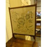 Edwardian mahogany glazed fire screen with embroidered panel