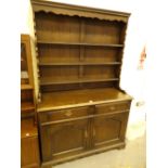 Oak dresser and three shelf top display with two drawers over two cupboards