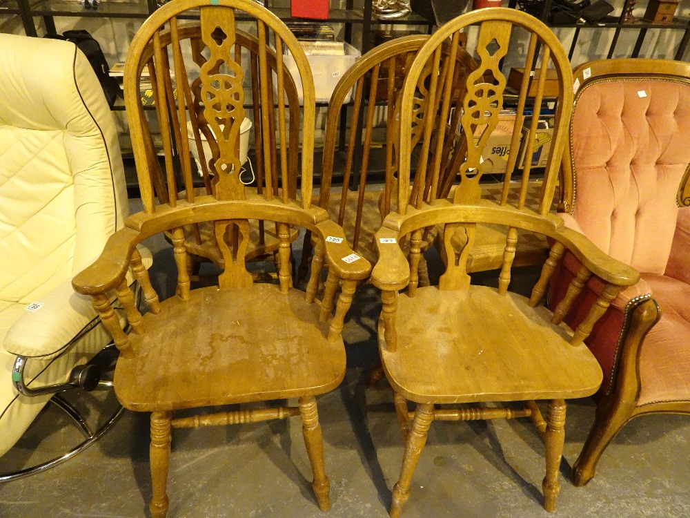 Set of four high wheelback dining chairs including two carvers