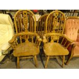 Set of four high wheelback dining chairs including two carvers