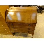 Mahogany bureau with three drawers on cabriole legs