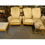 Three piece light wood Ercol suite armchair two seat settee and stool