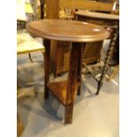 Circular Arts and Crafts tripod occasional table with three pierced legs