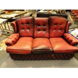 Three seater Chesterfield ox blood red suite with button back and arms