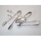 Four hallmarked silver tongs, assay Shef