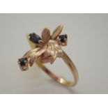 18ct gold sapphire set flower ring, size