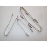 Four hallmarked silver tongs, assay Shef