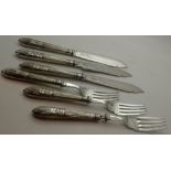 Three pairs of continental silver fish knives and forks