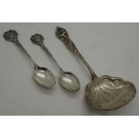 Art Nouveau silver sifter spoon and two silver teaspoons