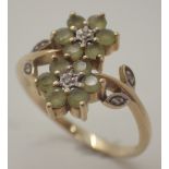 9ct gold green stone and small diamond flower ring Size T 2.