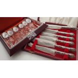 Boxed set of six silver handled butter knives and boxed set of six enamel tea spoons