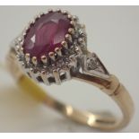 9ct ruby and diamond cluster ring approximately 1ct ruby size M