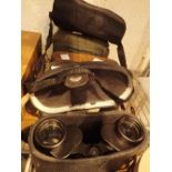 Four pairs of binoculars in cases and leather cases including Negretti and Zambra