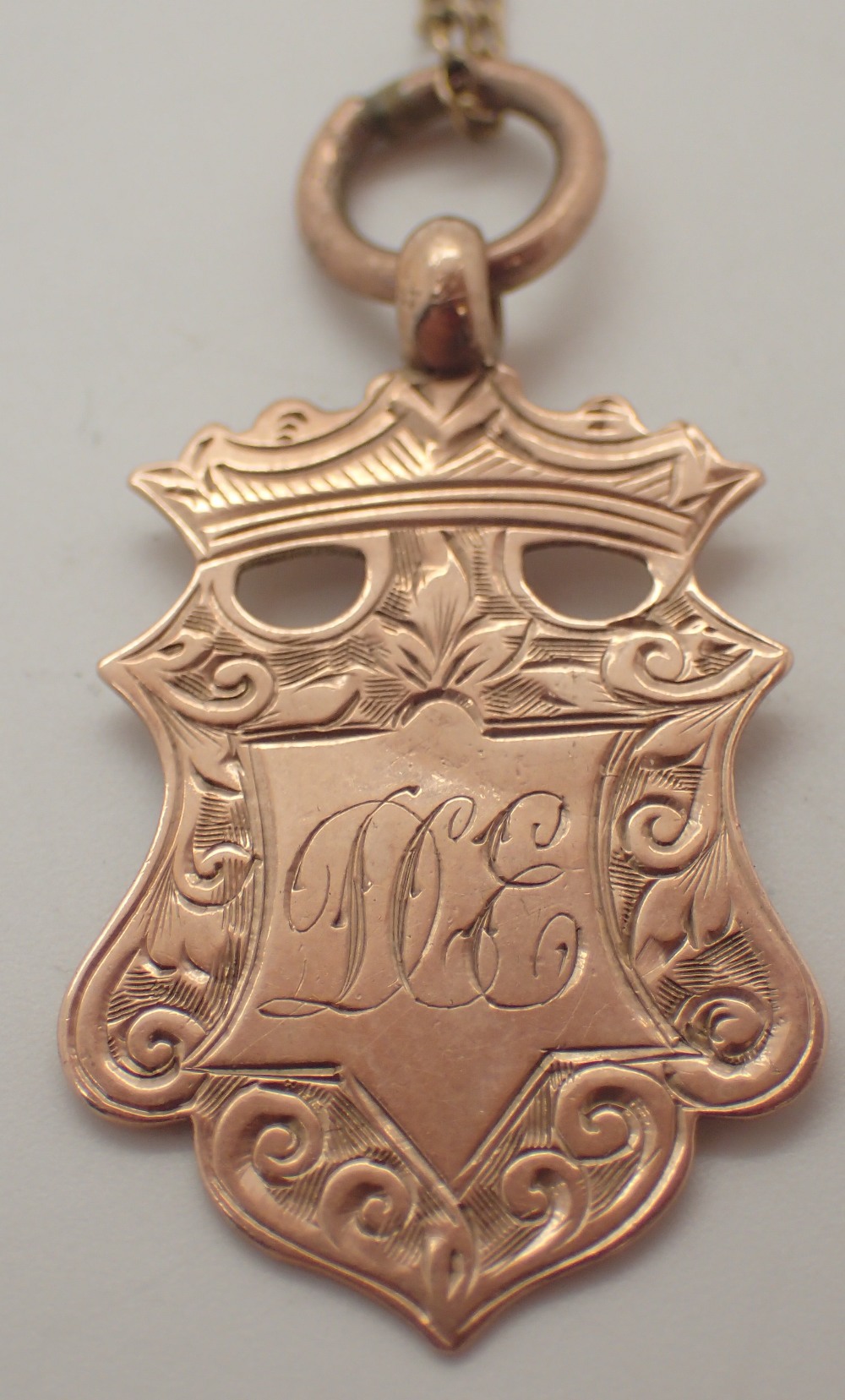 9ct gold fob on a 9ct gold chain 3.