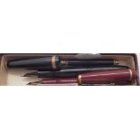 Two Parker fountain pens with 14ct gold nibs and an antique propelling pencil