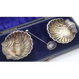 Pair of cased hallmarked silver scallop open salts one A/F and a silver salt spoon assay Birmingham