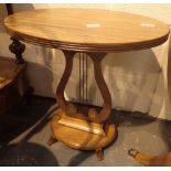 Oval side table with under tier and harp supports