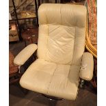 Retro style ivory leather swivel armchair with black piping and tubular stainless steel frame