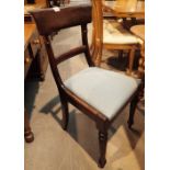 Six Victorian mahogany upholstered dining chairs with turned front legs