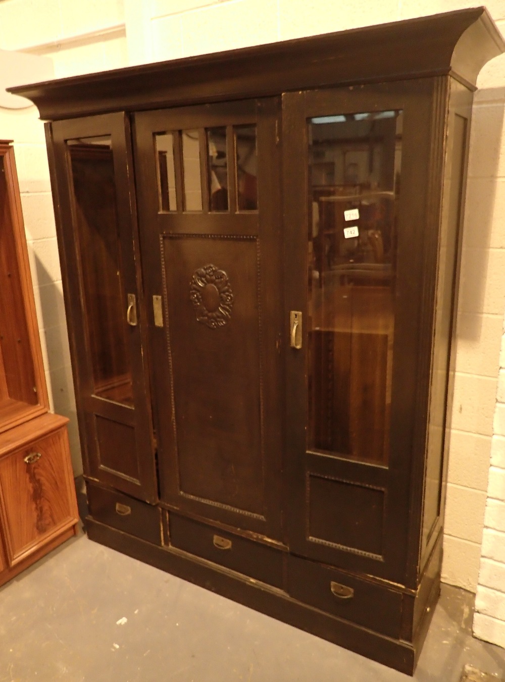 Oak bookcase with twin glazed doors central cupboard and three lower drawers H: 200 cm