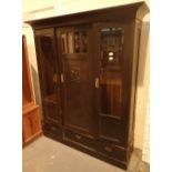 Oak bookcase with twin glazed doors central cupboard and three lower drawers H: 200 cm