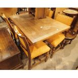 Oak drawleaf table and four chairs