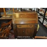 Oak fall front bureau with fitted interior, drawer and cupboard to base, 74 x 43 x 99cm