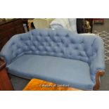 Blue upholstered settee with carved wood detail, on castors, 168 X 65 X 90 cm